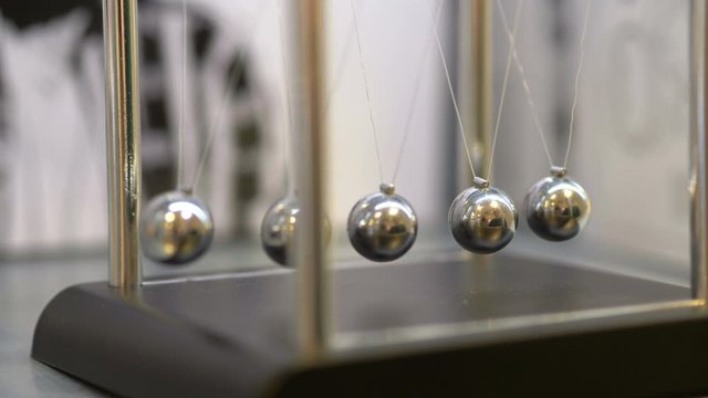 Pendulum With Swinging Metal Spheres in 4K slow motion 60fps