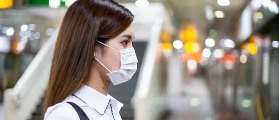 woman with mask in station