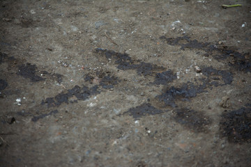 oil marks from car wheels pollution tread