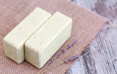 Pieces of natural natural handmade soap on a wooden surface
