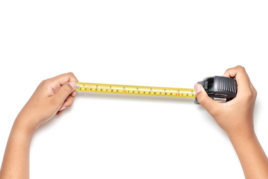 Close up view of man hand holding Tape measure. Human hands , isolated on white background measuring with construction roulette,  Engineer architecture.