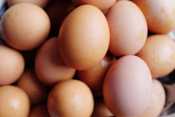 Closed up Fresh Drop of water on chicken eggs on basket. The benefits of eating eggs are high protein.