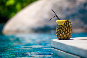 Pineapple juice near the swimming pool