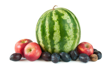 Composition of ripe fruit watermelon, apples, plums, walnuts isolated on a white background.