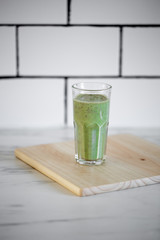 Detox diet concept: glass filled with green smoothie