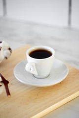 Coffee cup on wooden background
