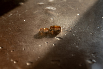 Beautiful gold background with wedding rings and stars