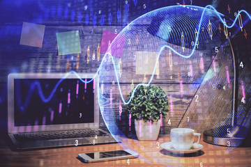 Multi exposure of chart and financial info and work space with computer background. Concept of...