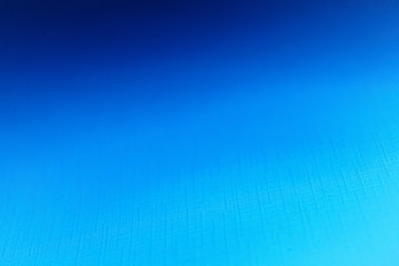 Blank carton paper sheets background in dark blue light, copy space