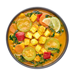 A Yellow Veg Thai Curry with Tofu and vegetables isolated on white background. Vegetarian Thai...