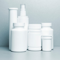 photo of six plastic cans for package pills and vitamins and antiseptic spray for protection...
