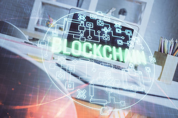 Multi exposure of blockchain and crypto economy theme hologram and table with computer background. Concept of bitcoin cryptocurrency.