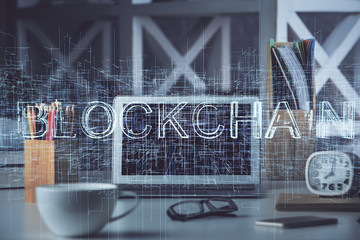 Multi exposure of blockchain and crypto economy theme hologram and table with computer background. Concept of bitcoin cryptocurrency.