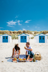 Picnic on the beach Texel Netherlands, couple having picnic on the beach of Texel with white sand...