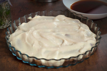 Process of making house made Tiramisu cake. Italian desert with Philadelphia cheese and eggs.