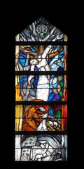 God’s promise gives men courage and hope in the path of their lives and salvation, stained glass window by Sieger Koder in St. John church in Piflas, Germany