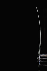 Glass vase, isolated on the black background.