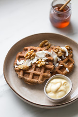 vegan sugar free buckwheat waffles, with walnut on marble background