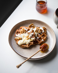 vegan sugar free buckwheat waffles, with walnut on marble background