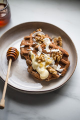 vegan sugar free buckwheat waffles, with walnut on marble background