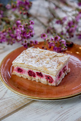 raspberry pie with blurred flowers