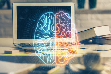 Double exposure of work space with computer and human brain drawing hologram. Brainstorm concept.