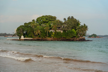 Weligama, Sri Lanka, sea waves  landscape with green island