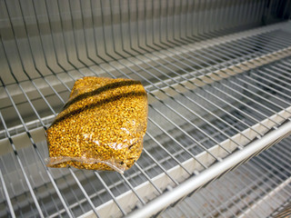 Groats on the counter of the store. The last packaging of cereals on the counter in the store. Food...