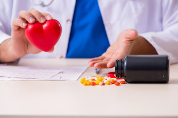 Young male doctor cardiologist working in the clinic