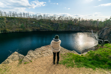 Woman standing in front of a stone quarry in Brandis, Saxony, Germany