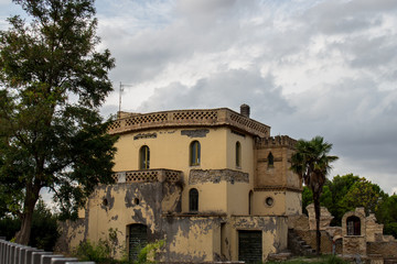 Fototapeta na wymiar Larino, Campobasso, Roman archaeological site on the modern building background, on a sunny day