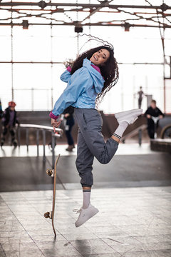 Beautiful Curly Black Girl With A Skateboard