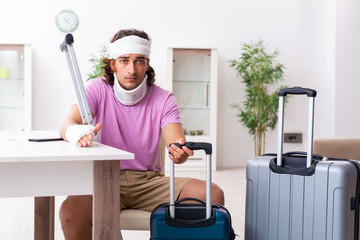 Young injured man preparing for the trip