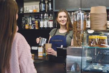 Barista woman in the bar.