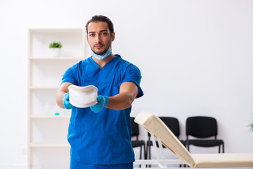 Young male doctor working in the clinic