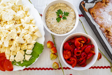 Homemade mashed vegetable paste and cheese in bowls and on bread at a local brunch