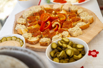 Homemade mashed vegetable paste in bowls and on bread at a local brunch
