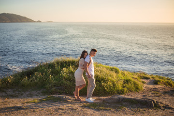 Fototapeta na wymiar Couple enjoying a summer afternoon with a sunset