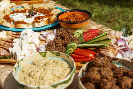 Traditional food platters made by villagers for a local brunch in the rural Romania