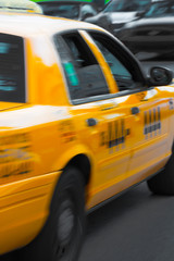 Yellow cab in move on the road