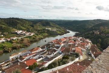 Fototapeta premium Mertola city view white historic beautiful traditional village in alentejo, Portugal with river guadiana and landscape