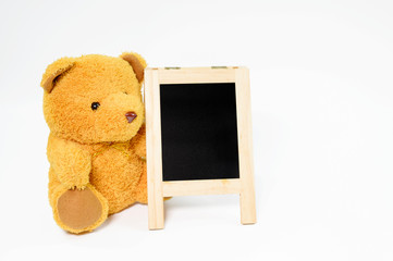 Black board with brown teddy bear