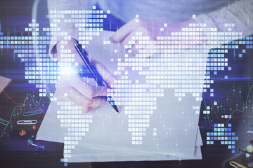 International business hologram over woman's hands taking notes background. Concept of success. Double exposure