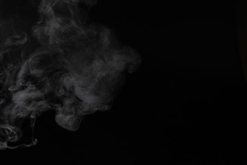 White steam on a black background.