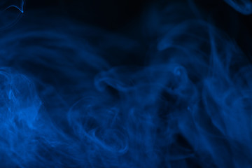 Blue steam on a black background.