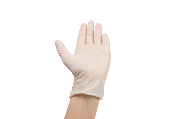 Woman puts on white rubber gloves.