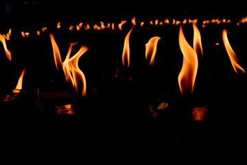 Line of Fire flames on black background.