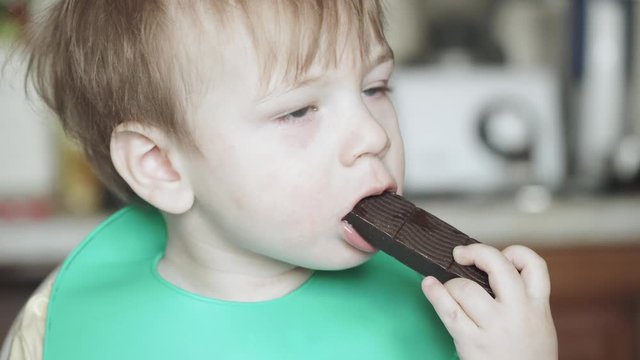 Boy eats hematogen