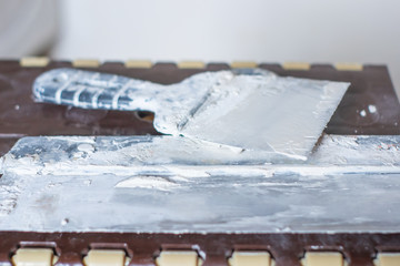 Construction/Circular trowel isolated on white background.