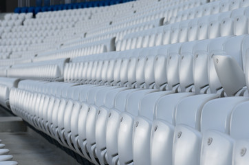 Empty white seats at the stadium during isolation period